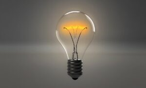 A bright light bulb illuminating to symbolises a new idea or a breakthrough innovation